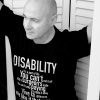 Simon Mark Smith wearing his "Disability, it's a part of life" T shirt